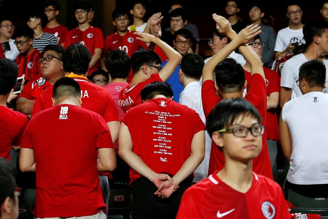 Hong Kong fans turn their backs during the Chinese national anthem before the Asian Cup match against Malaysia in Hong Kong,  in 2017. Photo: Reuters