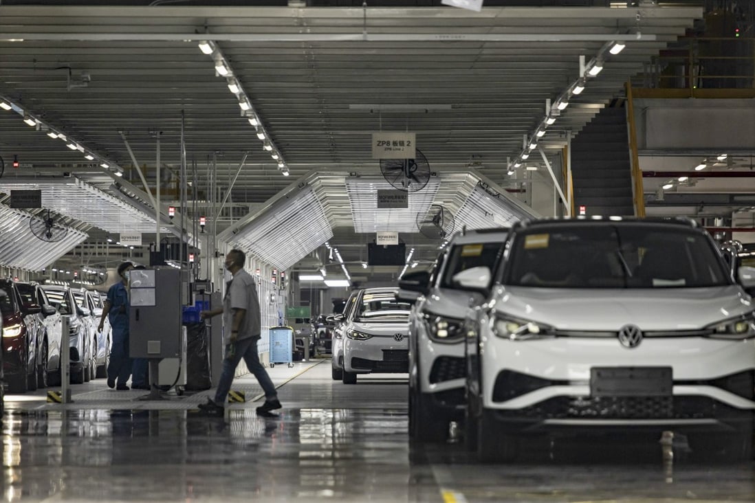 Volkswagen electric vehicles are assembled at a factory operated with local partner SAIC Motor, in Shanghai. Local Chinese governments are offering cash subsidies to boost sales of green cars. Photo: Bloomberg