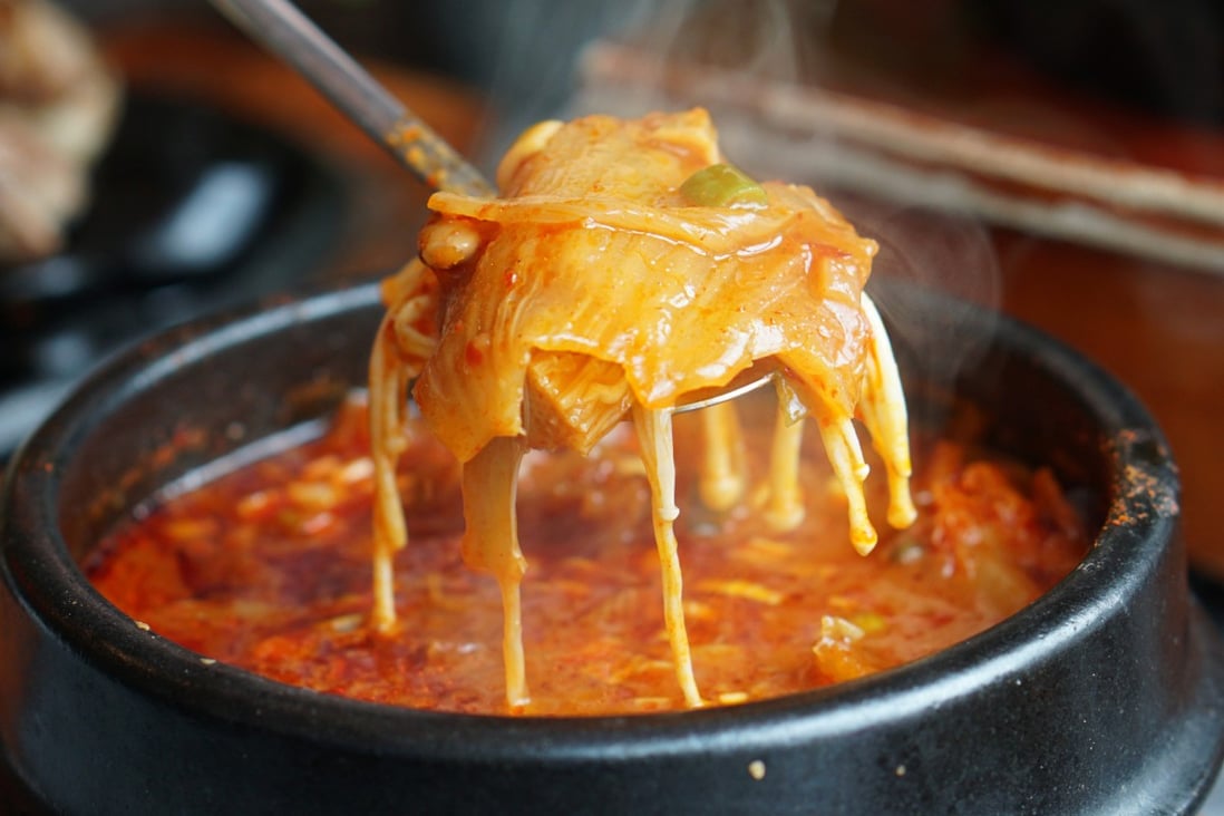 Kimchi soup with tofu and pork belly served in clay pot, one of the most loved of all the stews in Korean cuisine. Photo: Shutterstock