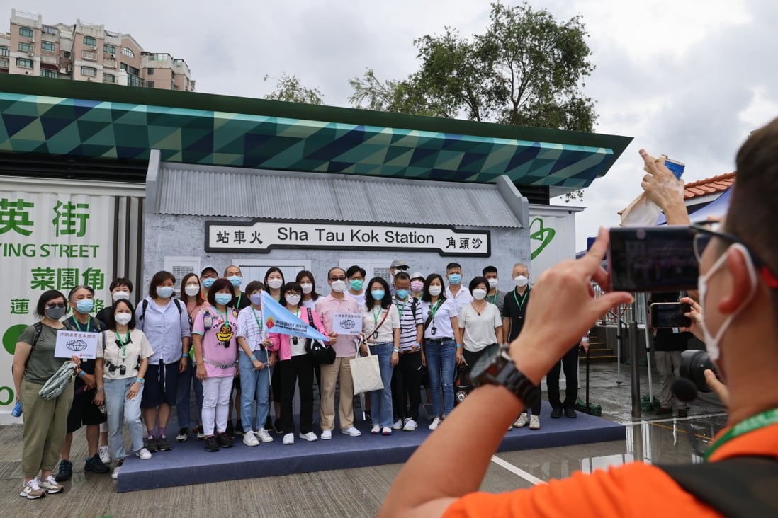 Tour groups pose at Sha Tau Kok on June 3. The historic town, located on the Hong Kong-Shenzhen border, opened its doors to tour agencies this year as part of a scheme to promote eco-tourism. Photo: Dickson Lee