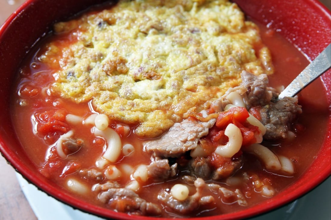 Tomato broth macaroni with luncheon meat and fried egg at Sing Heung Yuen  in Central - a place that food marketer Deanna Chuang says visitors to the city simply have to visit. Photo: SCMP