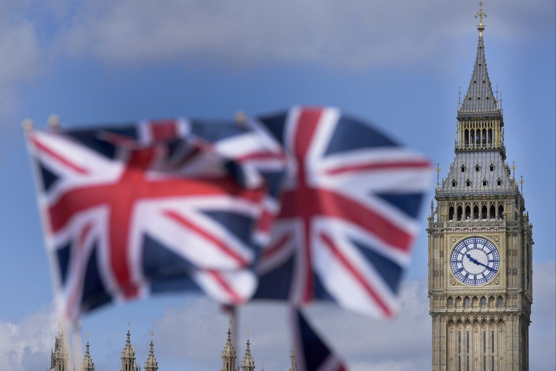 Union Jack flags are seen in front of the Elizabeth Tower, known as Big Ben, beside the Houses of Parliament in London. Photo: AP 
