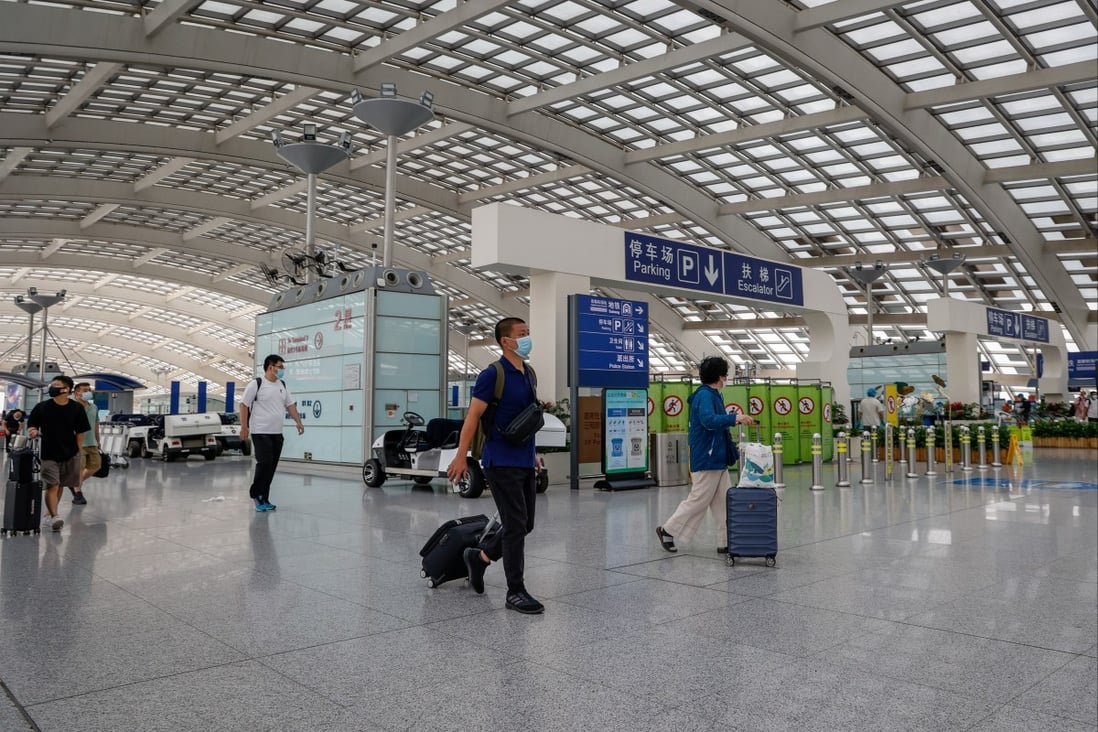 Travellers arrive at Beijing Capital International Airport on June 29, a day after China cut its quarantine period for overseas arrivals. Photo: EPA-EFE