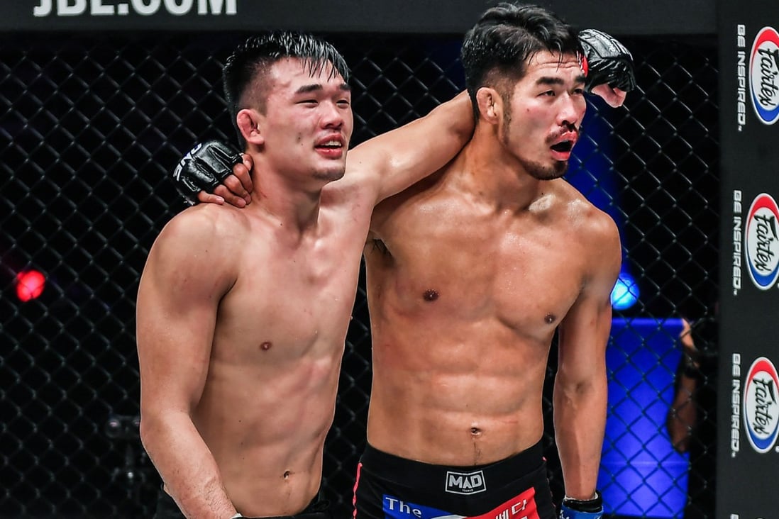 Christian Lee (left) and Ok Rae-yoon embrace after their five-round lightweight title fight at ONE: Revolution. Photos: ONE Championship