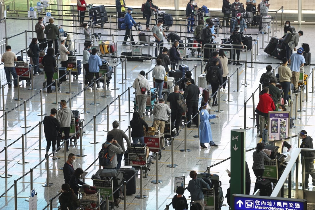 Passengers arrive at Hong Kong’s airport. The city has some of the world’s strictest control measures. Photo: K. Y. Cheng