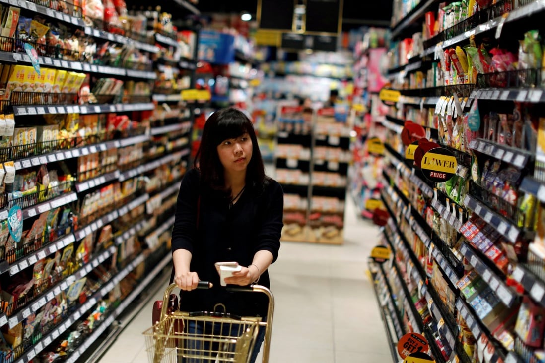 A customer browses supermarket shelves in Bangkok. Global food prices are surging. Photo: Reuters