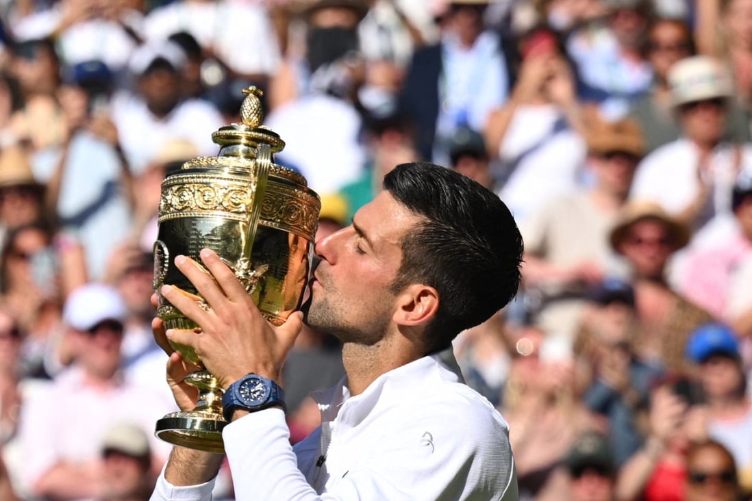 Serbia’s Novak Djokovic kisses his trophy after defeating Australia’s Nick Kyrgios during the Wimbledon men’s singles final near London, UK on Sunday. Photo: AFP
