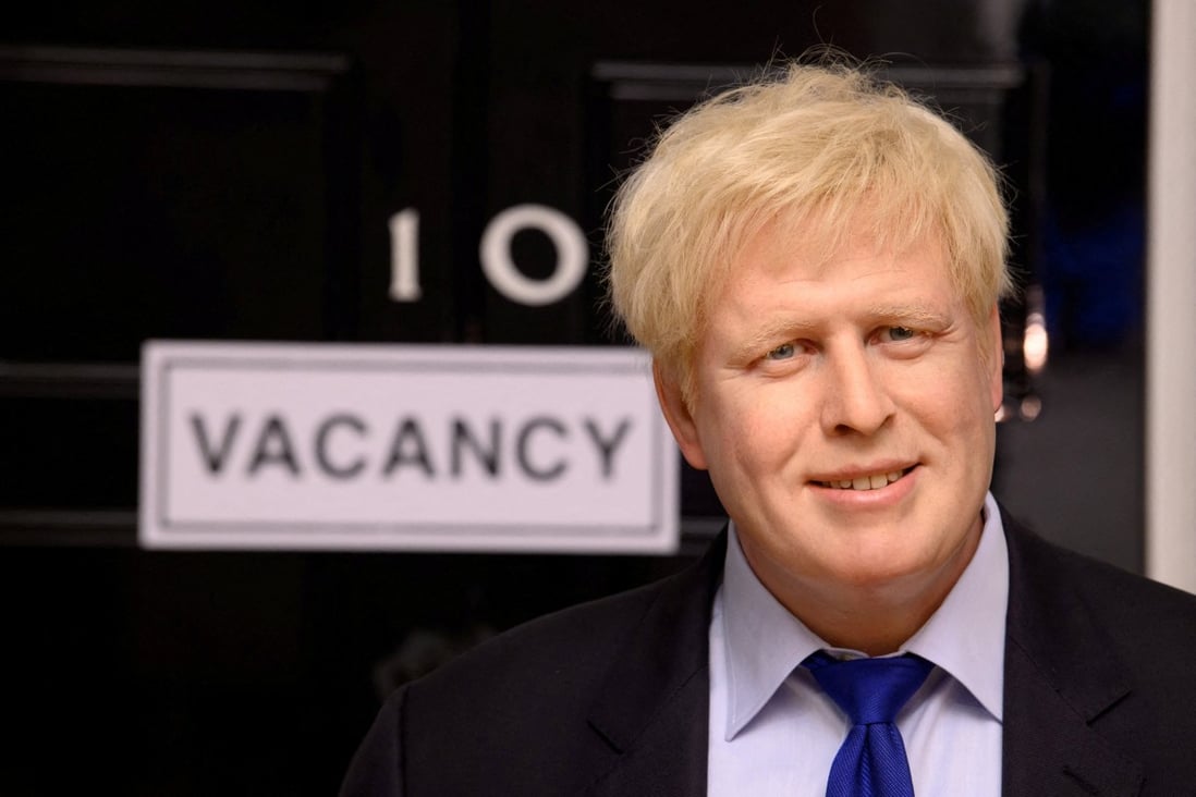 A wax figure of British Prime Minister Boris Johnson is pictured next to a “vacancy” sign on 10 Downing Street at Madame Tussauds in London on July 7. Photo: Madame Tussauds London via Reuters
