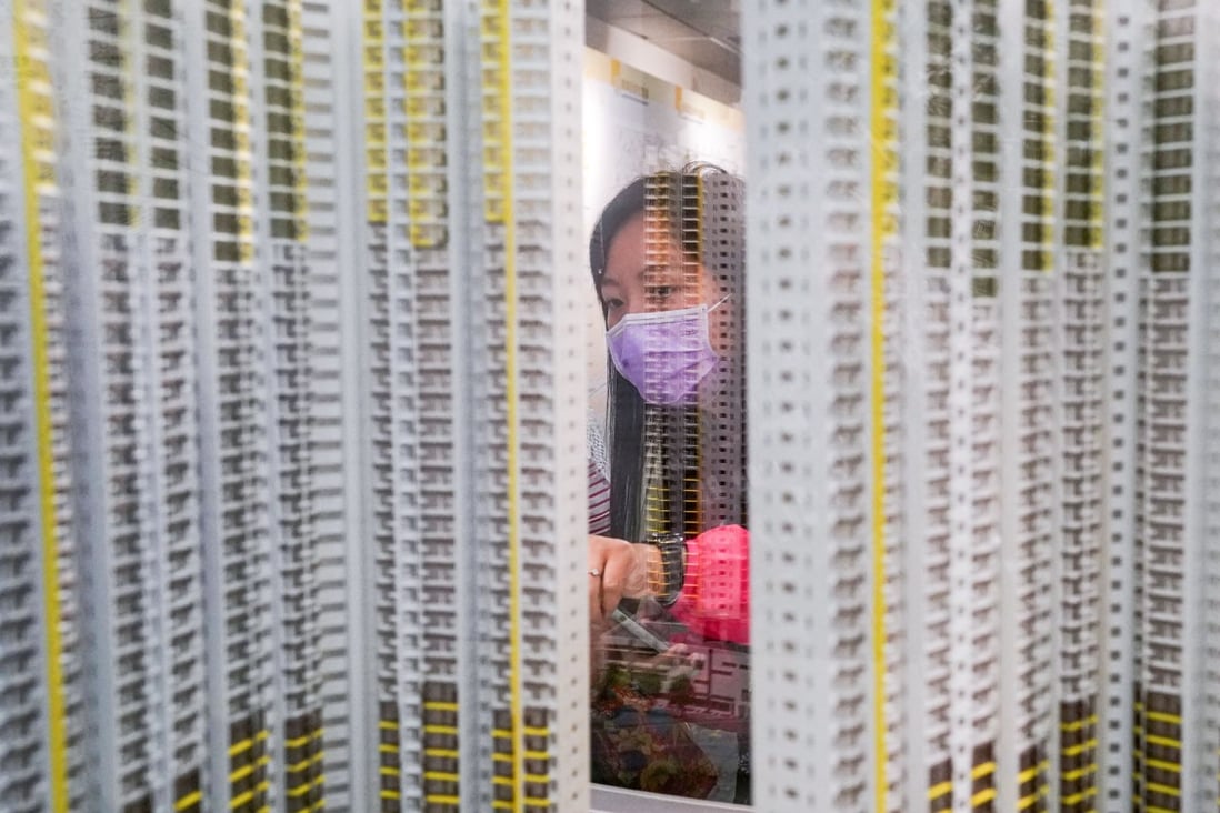 A potential homebuyer views a model at the Housing Authority’s Home Ownership Scheme Sales Unit in Kwun Tong district, in this file photo from August 2020. Photo: Felix Wong