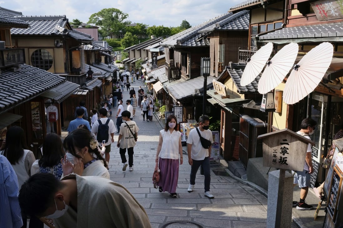 Visitors walk on the Ninenzaka road in Kyoto, Japan, on June 26, 2022. Once weary of hordes of foreign tourists crowding its narrow streets and ignoring etiquette, many in Japan’s ancient capital of Kyoto are longing for their return. Photo: Bloomberg