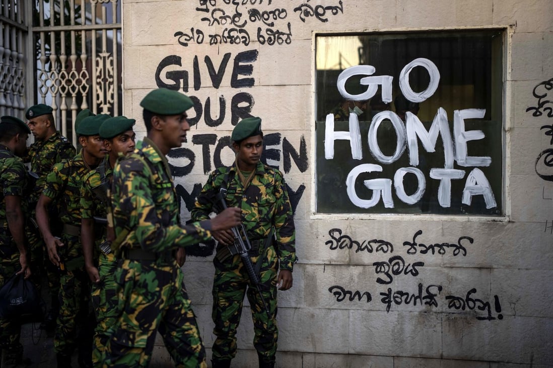 Sri Lankan soldiers patrol near the official residence of president Gotabaya Rajapaksa on Tuesday, three days after it was stormed by protesters in Colombo. Photo: AP