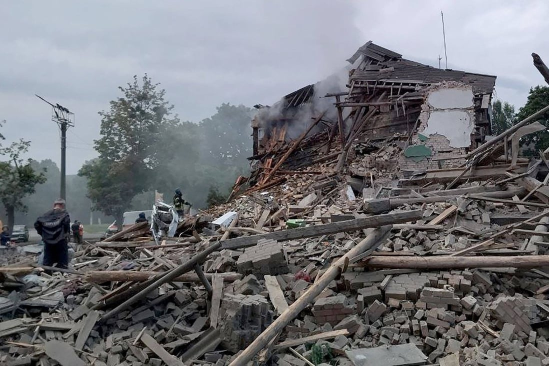 Firefighters remove rubble from a destroyed building after a missile strike in the city of Nikopol, amid the Russian invasion of Ukraine. Photo: via AFP