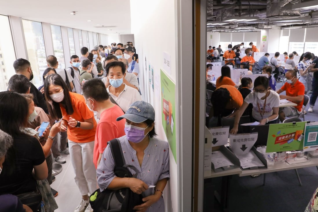 Residents queue up at the consumption voucher service centre in Mong Kok on Friday after learning they are not eligible for the second tranche of e-coupons. Photo: Yik Yeung-man