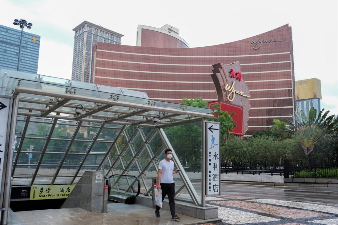 A man walks outside the Wynn Macau casino resort amid the Covid-19 outbreak, in Macau on July 4, 2022. Poor gaming earnings pulled down casino stock in Hong Kong on Tuesday. Photo: Reuters