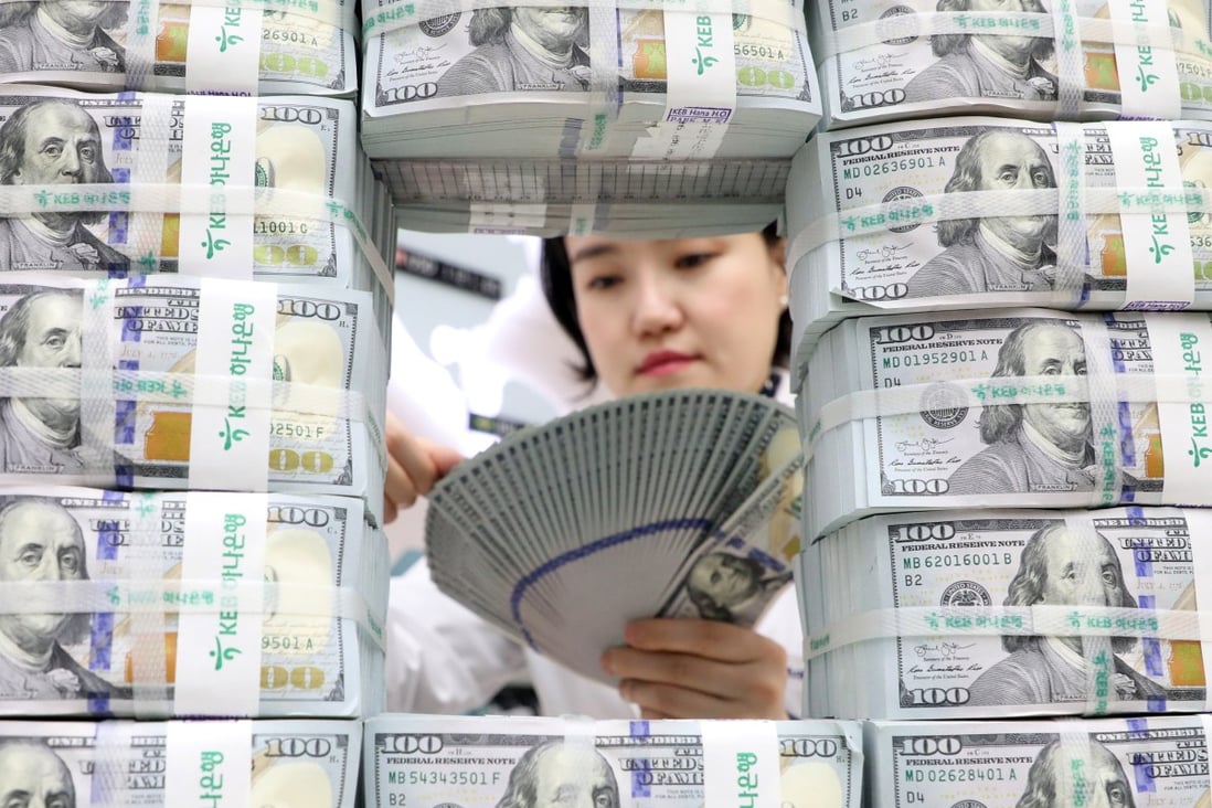 China’s holdings of US treasuries fell from US$1.003 trillion in April to US$980.8 billion in May, according to US Department of the Treasury on Monday. Photo: EPA-EFE