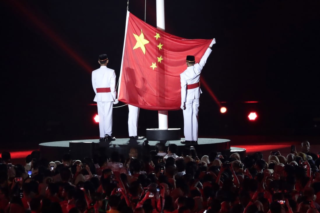 The Chinese flag is raised as the next host country during the closing ceremony for the 18th Asian Games in Jakarta, Indonesia on Sept. 2, 2018. Photo: AP