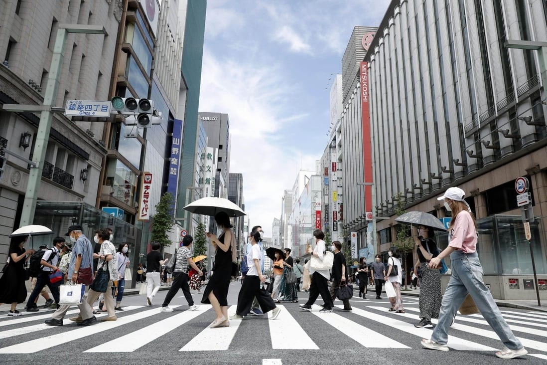 Tokyo’s Ginza shopping area where people are wearing face masks in the street. Photo: Kyodo
