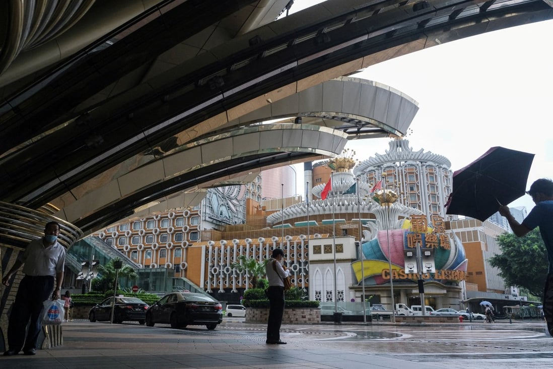 People stand near Casino Lisboa amid the Covid-19 outbreak in Macau on July 4, 2022. Photo: Reuters