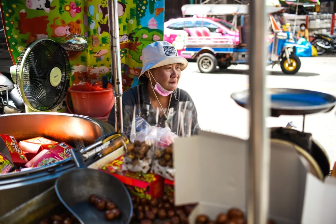 A Thai street vendor waits for customers in Bangkok. Photo: Shutterstock