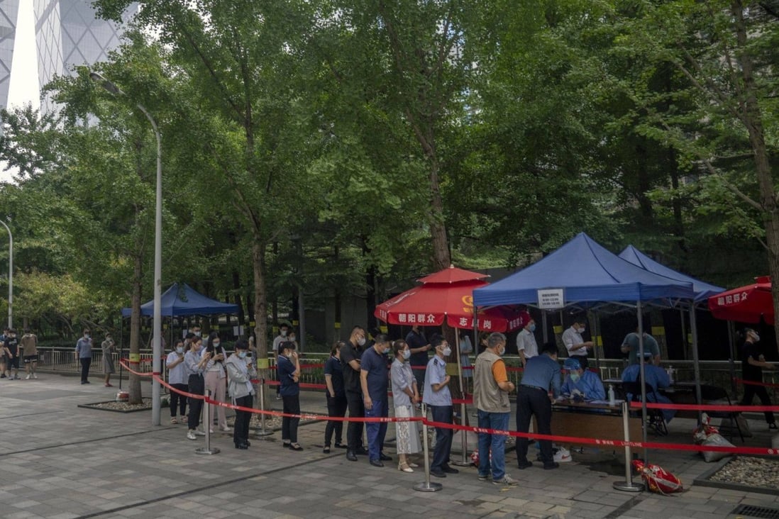 Residents queue at a Covid-19 testing booth in Beijing on July 27. China is sticking to its “dynamic zero-Covid” strategy of lockdowns, movement restrictions and mass testing. Photo: Bloomberg