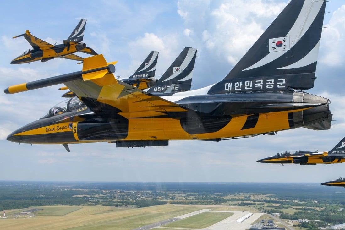 The Republic of Korea Air Force shows the Black Eagles South Korean aerobatic flight team staging a performance aboard T-50 trainer jets at an air base in Deblin, Poland. The Polish government signed a contract to purchase 48 FA-50 light attack fighters from Korea Aerospace Industries the same day. Photo: EPA-EFE/ROK Air Force handout