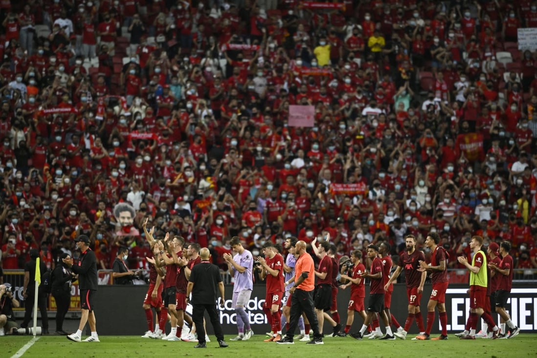 Liverpool players applaud fans after a match at the National Stadium in Singapore on July 15. A similar international sporting event is unthinkable in Hong Kong, under the current administration’s pandemic policy. Photo: Reuters 