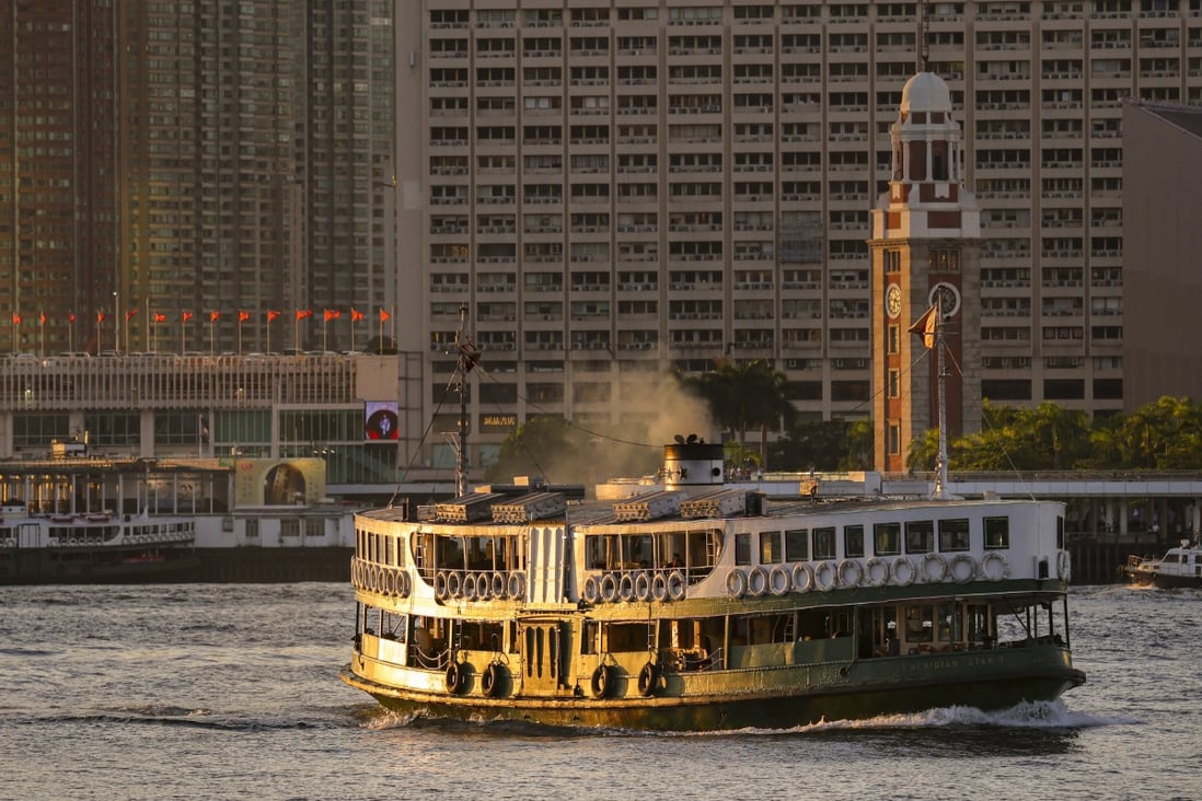 A Star Ferry sails across Victoria Harbour at sunset. Photo: Nora Tam