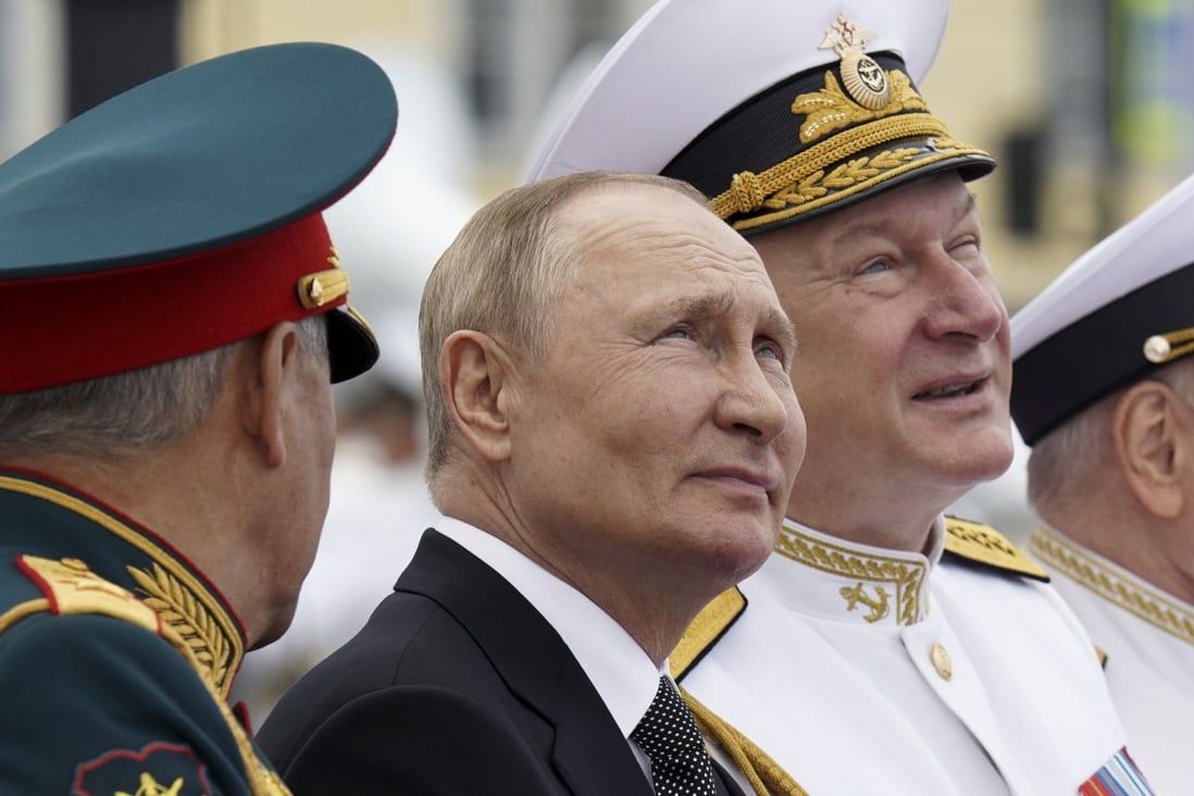 Russian President Vladimir Putin watches  the military parade during Navy Day celebrations in St Petersburg. Photo: AP