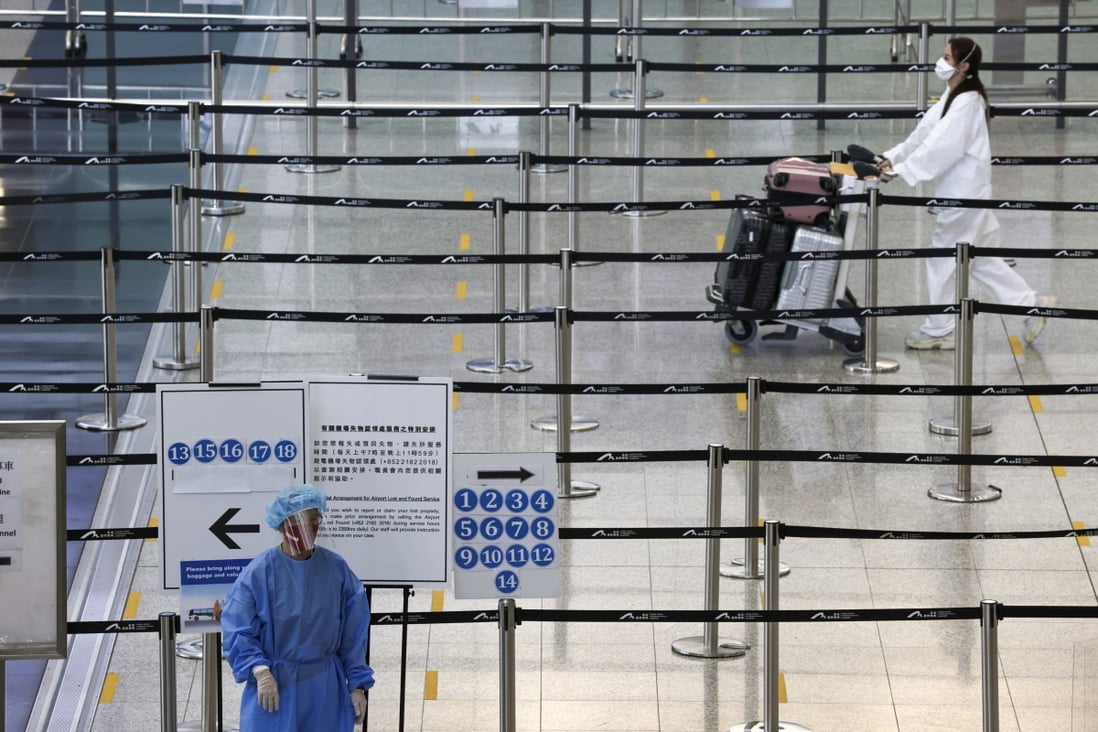 Arrivals at Hong Kong International Airport. Even a shortened quarantine time is ‘not ideal’ for international investors, says Nelson Chow, the HKIFA’s chairman. Photo: K Y Cheng