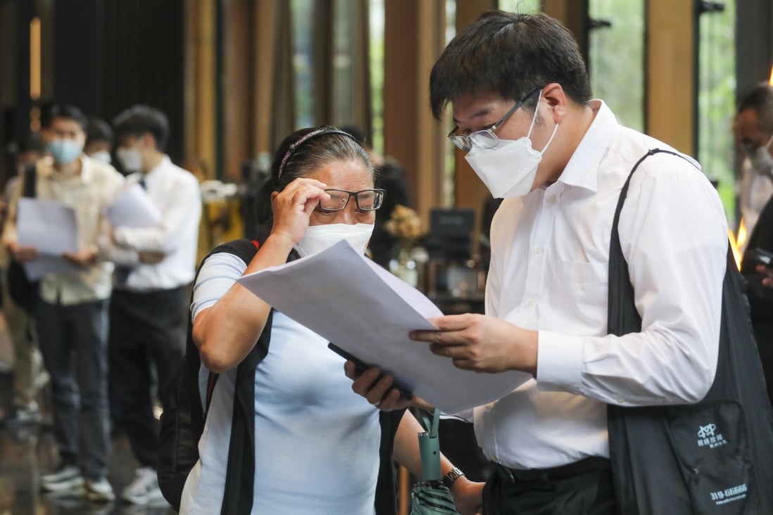 Potential buyers consider flats at Centralcon Properties’ The Aries development at Kingston International Centre in Kowloon Bay on May 27, 2022. Photo: SCMP / Xiaomei Chen