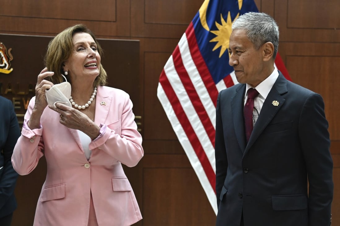 US House Speaker Nancy Pelosi removes her face mask as she meets Malaysia’s Parliament Speaker Azhar Azizan Harun in Kuala Lumpur on Tuesday. Photo: Handout via AP