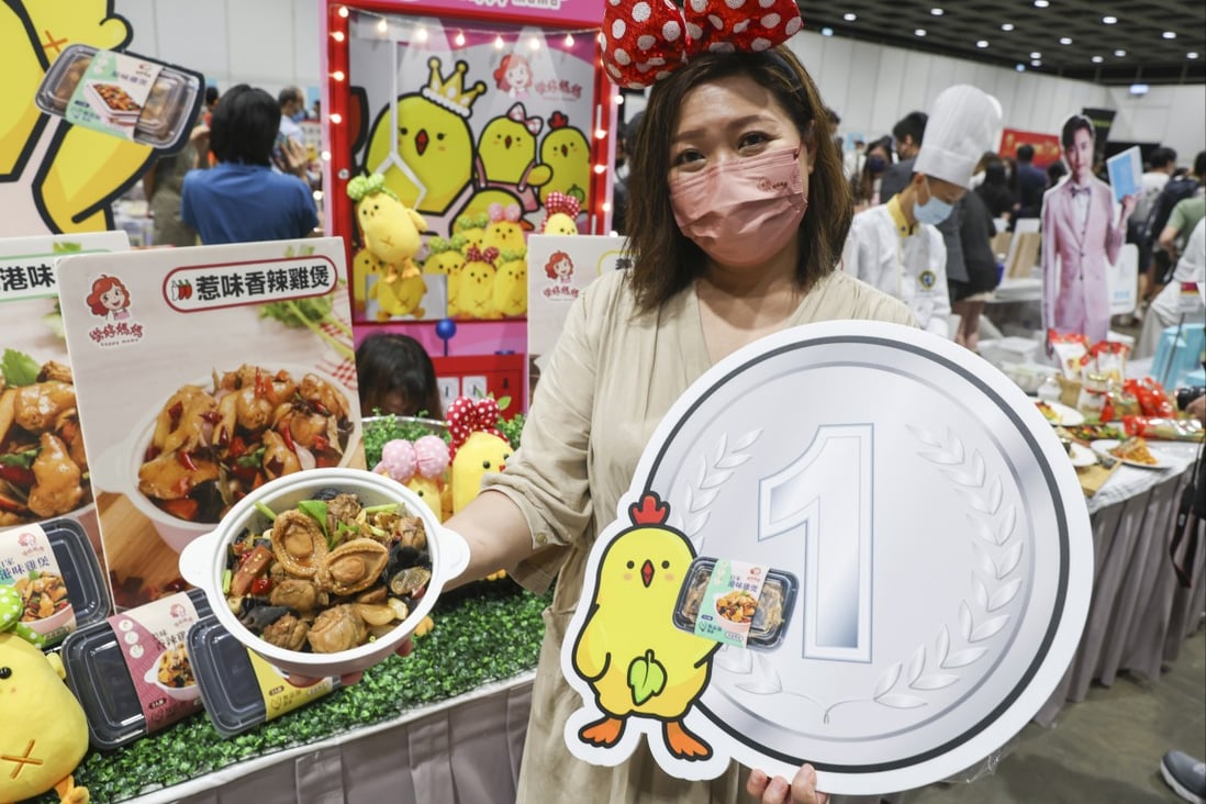 Jessica Leung Wing-sze, founder of Enjoy Party Catering shows off a chicken pot at the preview of the Hong Kong Food Expo 2022 at Hong Kong Convention and Exhibition Centre in Wan Chai.
Photo: Yik Yeung-man
