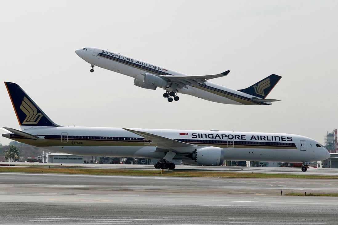 A Singapore Airlines aircraft takes off behind another of the carrier’s planes at Singapore’s Changi Airport. Photo: Reuters