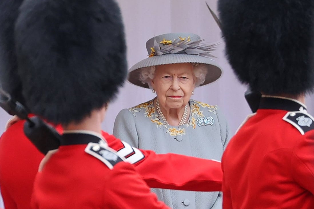 Britain’s Queen Elizabeth watches a military ceremony to mark her official birthday at Windsor Castle in June 2021. Photo: AFP