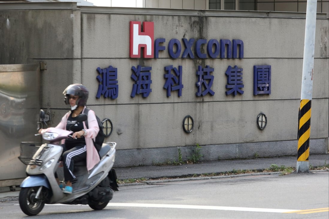 A person rides a scooter past a Foxconn office building in Taipei, Taiwan, on July 14, 2020. Photo: Reuters