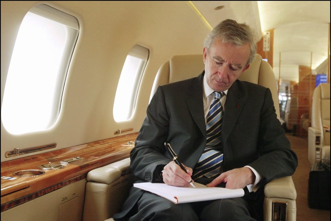 LVMH CEO Bernard Arnault on board his private jet flying between Beijing and Shanghai. Photo: Marc Deville/Gamma-Rapho via Getty Images