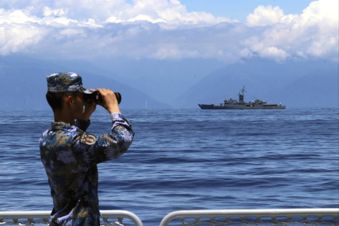 State news agency Xinhua published a photo of a Chinese serviceman looking at the Taiwan coast on board a warship. Photo: AP
