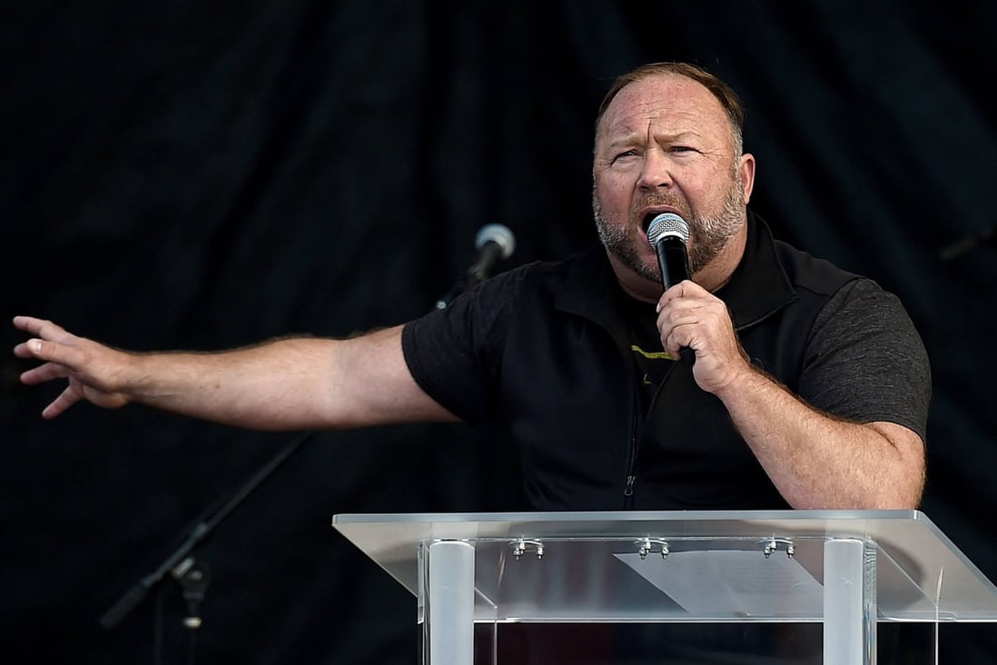 US far-right radio show Alex Jones speaks to Trump supporters as they demonstrate in Washington in December 2020. Photo: AFP