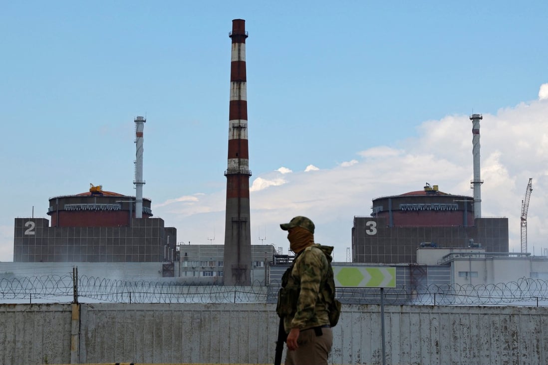 A serviceman with a Russian flag on his uniform stands guard near the Zaporizhzhia nuclear power plant outside the Russian-controlled city of Enerhodar in the Zaporizhzhia region, Ukraine. Photo: Reuters