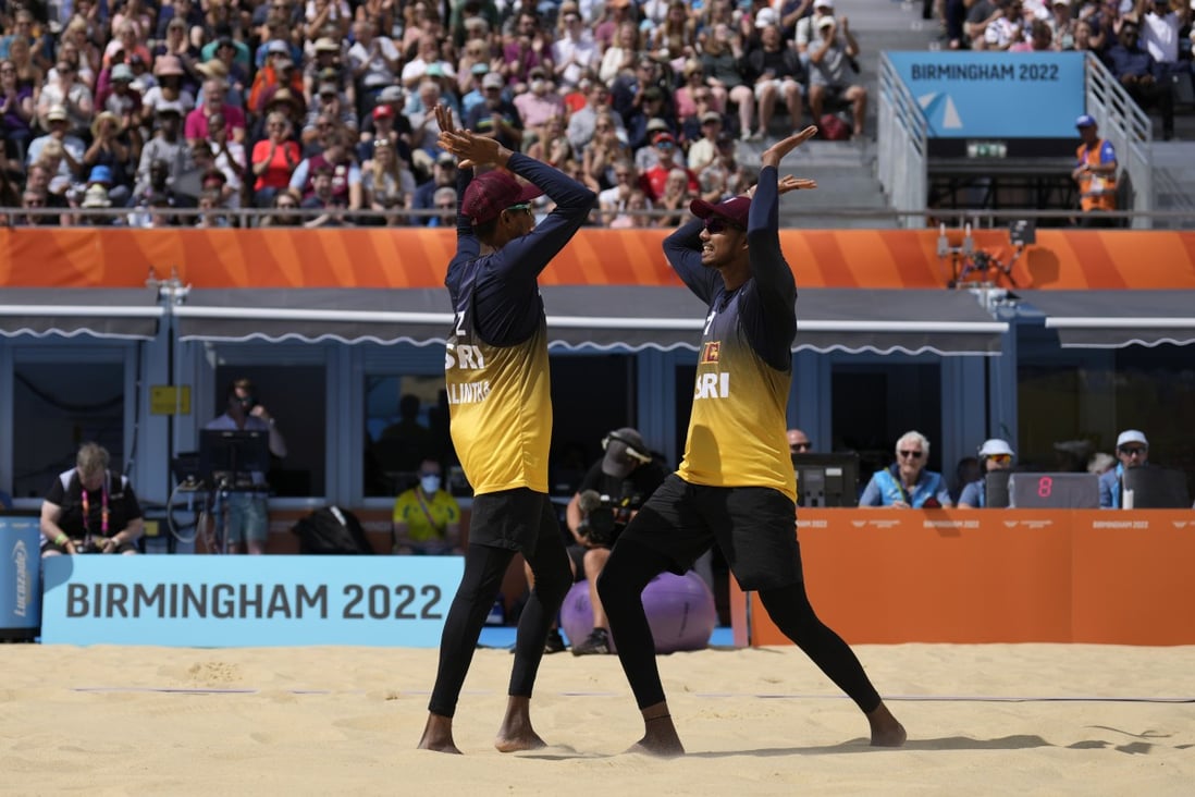 Sri Lankan players celebrate scoring a point during the men’s beach volleyball quarterfinal match against Australia at the Commonwealth Games in Birmingham on Friday. Photo: AP