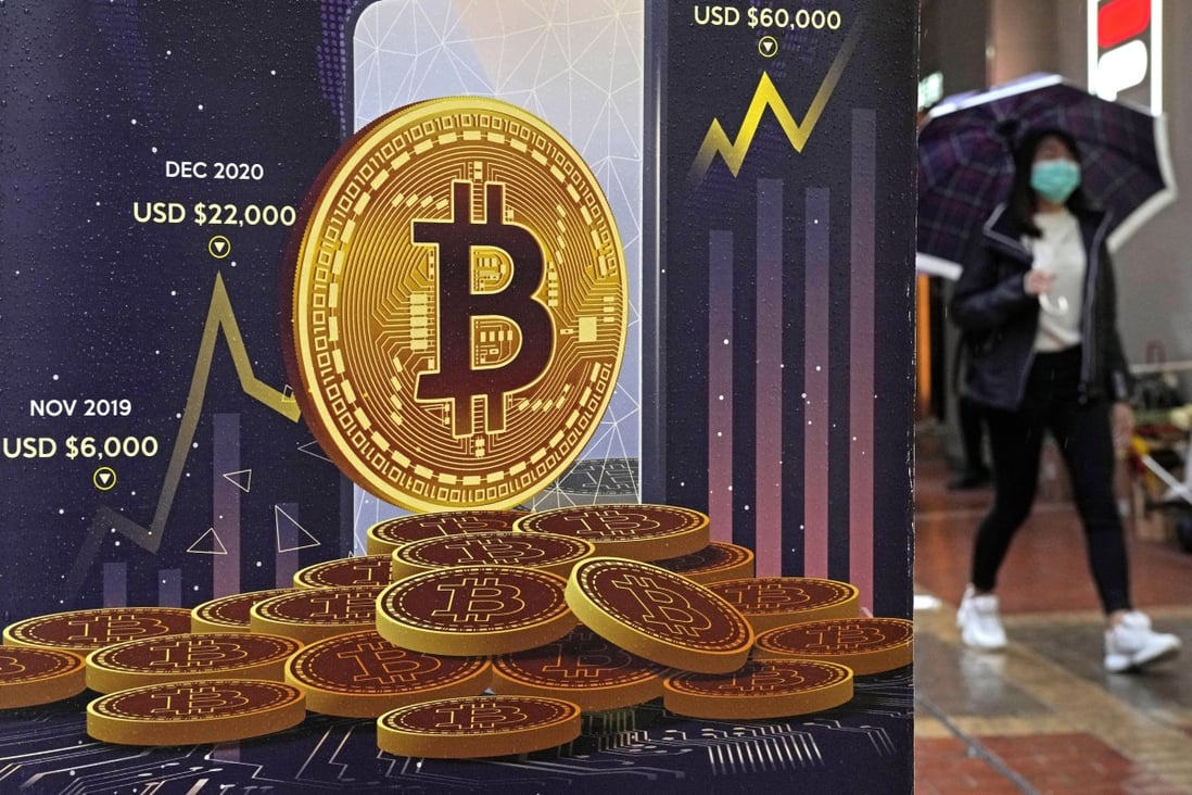 An advertisement for bitcoin is displayed on a street in Hong Kong on February 17. Photo: AP 