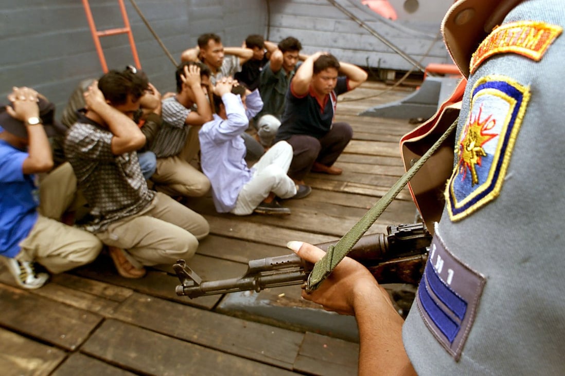 The Indonesian Navy conducts a drill with sailors role-paying as ship hijackers at the Singapore Strait near Batam in 2000. File photo: AP