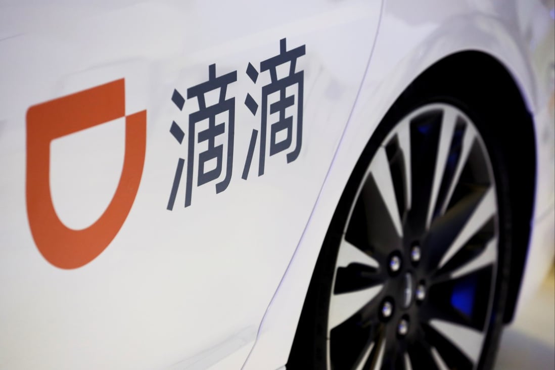The logo of Didi Chuxing seen on a car door at the IEEV New Energy Vehicles Exhibition in Beijing on October 18, 2018. Photo: Reuters