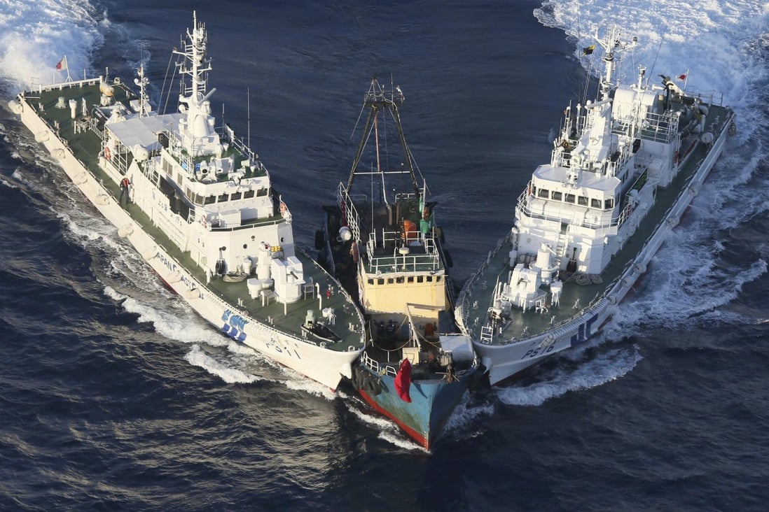 Japanese coastguard ships intercept the Kai Fung No 2 at the Diaoyu Islands in 2012 . Photo: AFP
