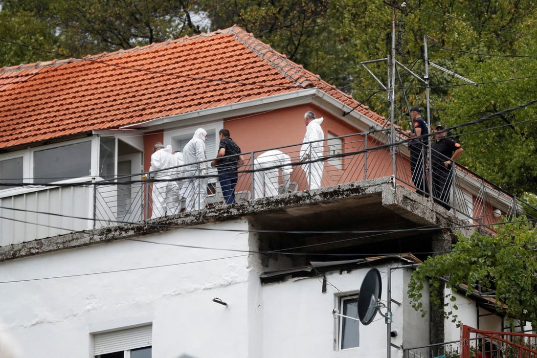 A police forensic team inspects the house where a gunman started a mass shooting in Cetinje, Montenegro on Friday. Photo: Reuters 