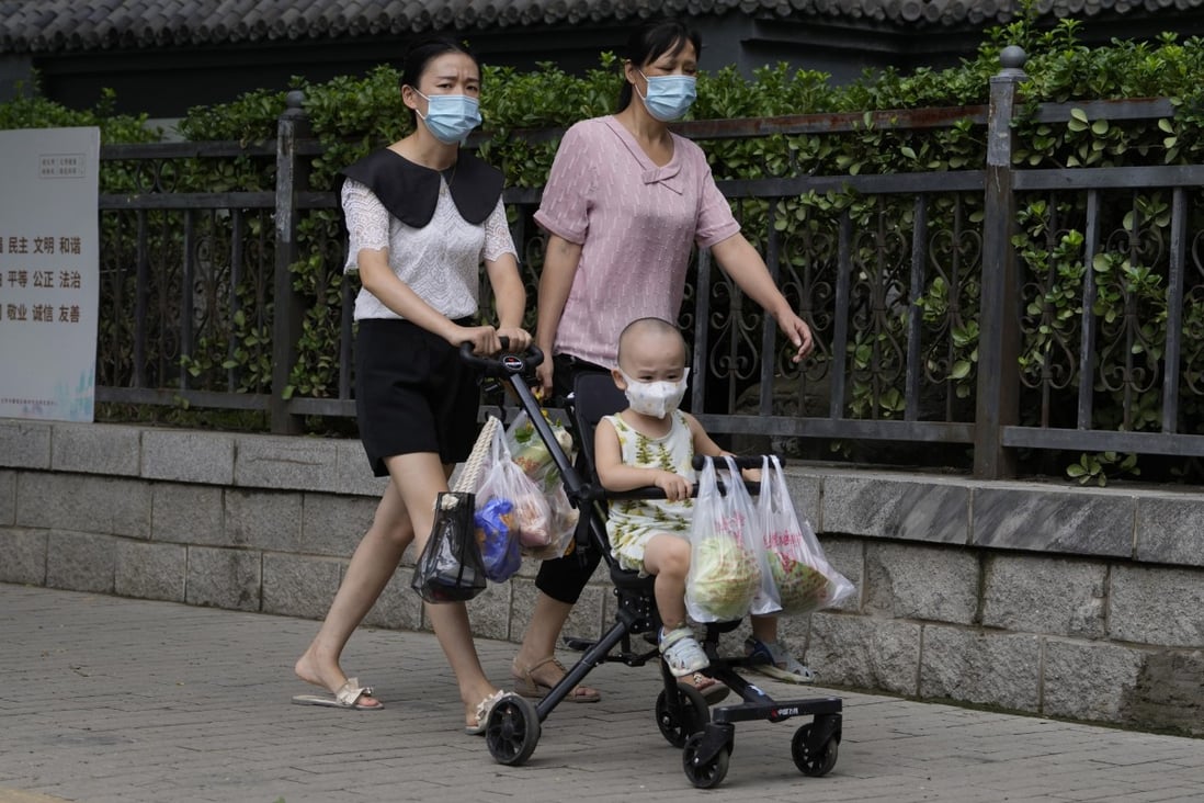 Shoppers carrying fresh produce in Beijing on Monday. China is trying to shore up sagging economic growth, battered by its zero-Covid policy. Photo: AP Photo