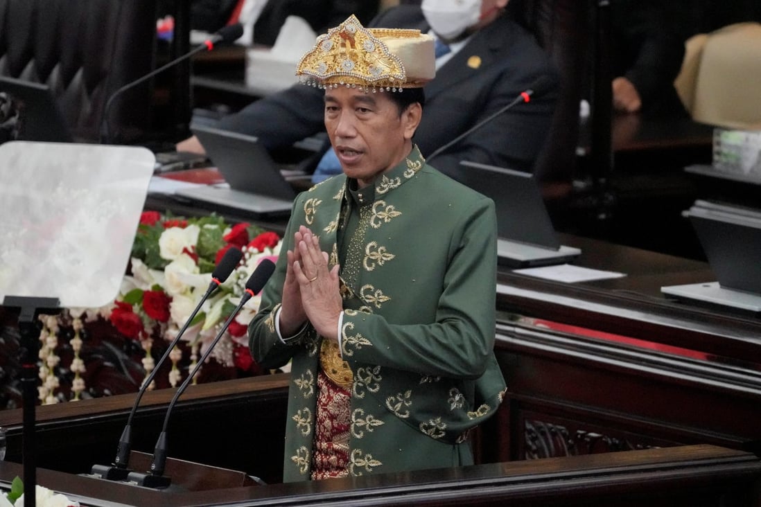Indonesian President Joko Widodo, wearing traditional attire from the Bangka Belitung islands, gestures as he delivers a state of the nation address in Jakarta on Tuesday ahead of the country’s independence day. Photo: Reuters