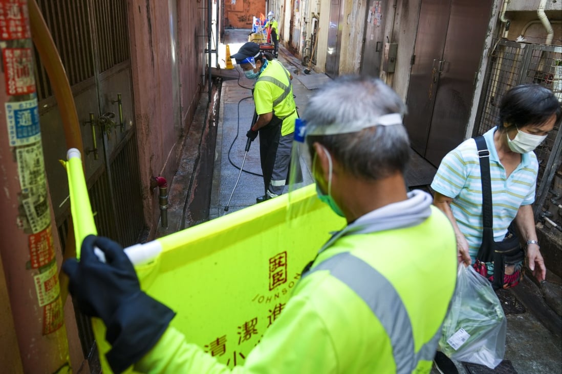 Contractors workers clean an alley in Prince Edward. The Hong Kong government has identified more than 600 black spots in the city to undergo a hygiene boost. Photo: Sam Tsang