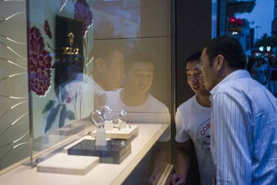 Cash is king in an unstable economy, and wealthier Chinese are selling their pre-owned luxury goods, such as Rolex watches, to make a quick buck. Photo: AFP
