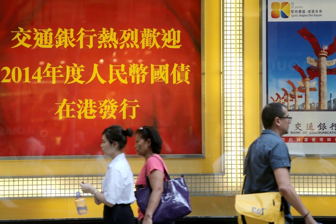 A billboard at the Bank of Communications branch in Central marking the issuance of yuan-denominated bonds in Hong Kong on 21 May 2014. Photo: SCMP